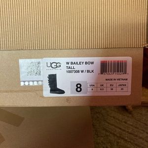 UGG tall bow black boots. Size 8 womens. Only worn once, but never outside.